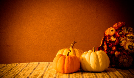 Tiny pumpkins and dry flower  on tabl stil llifeの写真素材