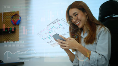 A teenage girl looking at stock charts or crypto currency growth through a hologram screen, she is...