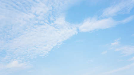 Blue sky with clouds backgroundの写真素材