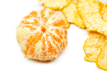 Orange posed on a orange peel against white backgroundの写真素材