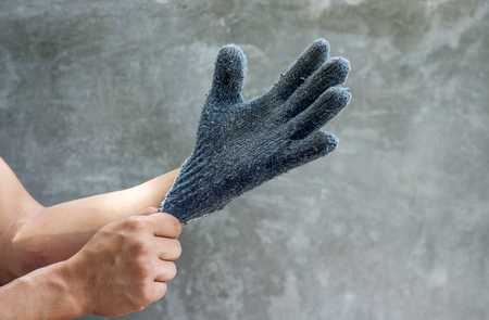 man wearing a gray glove.の写真素材