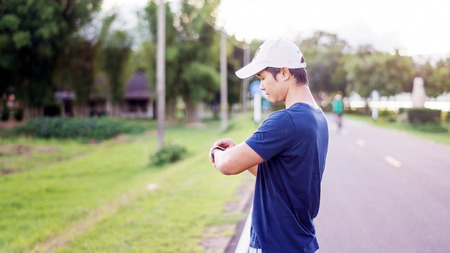 Asian man prepares for a workout at the public park, vintage colors.の写真素材
