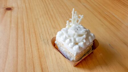 coconut cake on a wooden table background.