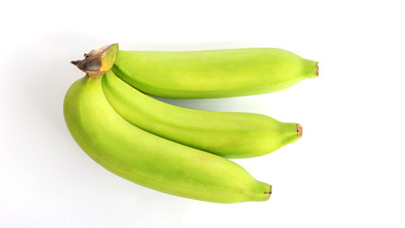 Green banana on white background.の写真素材
