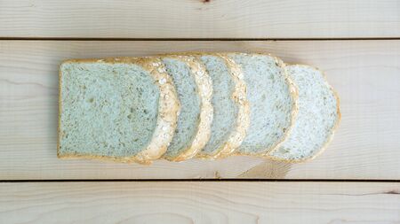 whole wheat bread on wooden background.の写真素材