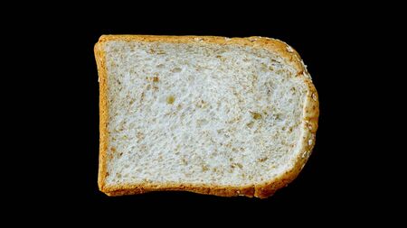 whole wheat bread on black background.
