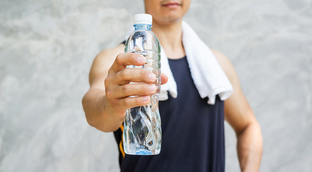 Man holding a bottle of water.の写真素材