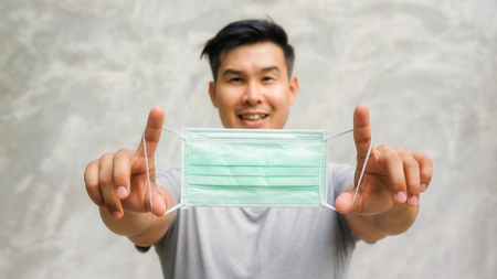 Asian man wears a protective mask.の写真素材