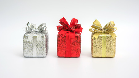 silver, red, and gold gift box on a white background.