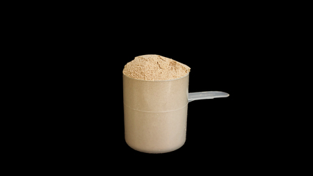 the whey protein on a black background.
