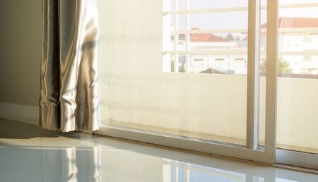Curtain at the balcony door and sunlight.の写真素材