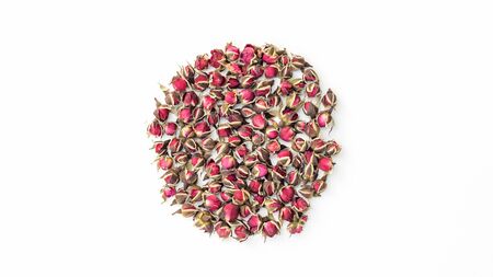 Dried pink rose on a white background.の写真素材