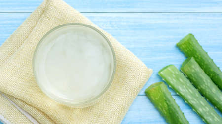 Aloe vera juice on a blue wooden table.の写真素材