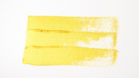 Gold colored poster watercolor on white background.の写真素材