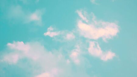 Clouds on a blue sky in a pastel color.の写真素材