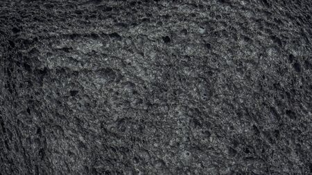 Close up of black charcoal bread for a background.