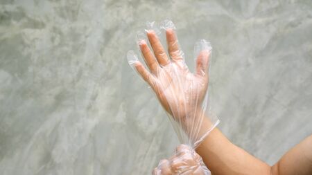 Men wear a glove on a gray background.の写真素材