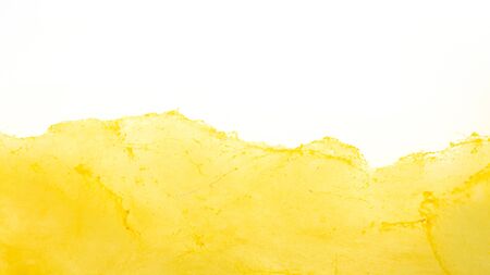 Yellow cotton candy on a white background.の写真素材