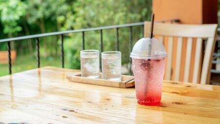Mixed berry soda on a wooden table.