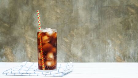 Iced aerated soft drink on a white wooden table.の写真素材