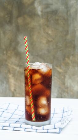 Iced aerated soft drink on a white wooden table.の写真素材