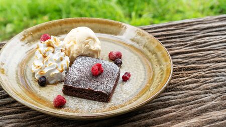 Brownie cake on a wooden table.の写真素材