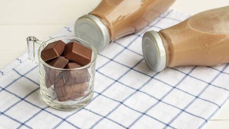 Chocolate milk on a white wooden table.の写真素材