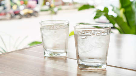 Iced water on a wooden table.の写真素材