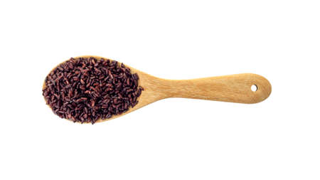 Riceberry on a wooden ladle on a white background.の写真素材