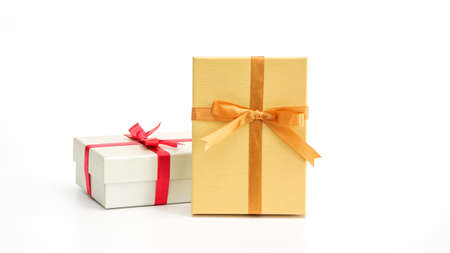 Silver and gold gift box on a white background.の写真素材