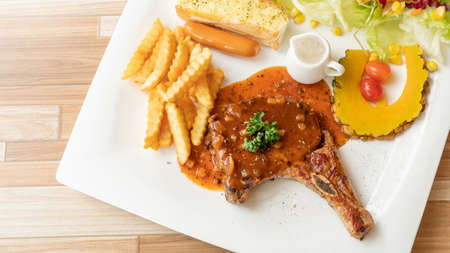 Pork Chop steak on a white plate.の写真素材