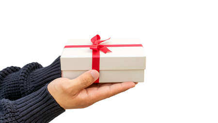 Man holding a silver gift box on a white background.の写真素材