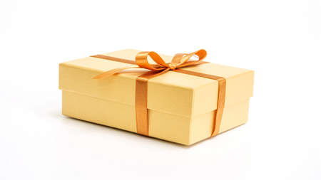 Gold gift box on a white background.の写真素材