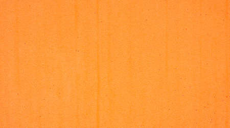 Close up of an orange sponge for a background.の写真素材
