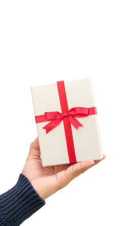 Man holding a silver gift box on a white background.の写真素材