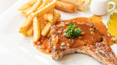 Pork Chop steak on a white plate.の写真素材