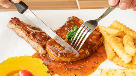 Pork Chop steak on a white plate.の写真素材