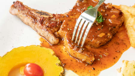 Pork Chop steak on a white plate.の写真素材