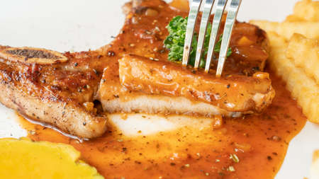 Pork Chop steak on a white plate.の写真素材