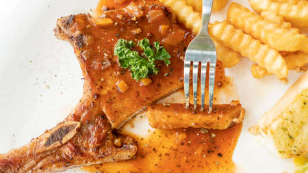 Pork Chop steak on a white plate.の写真素材