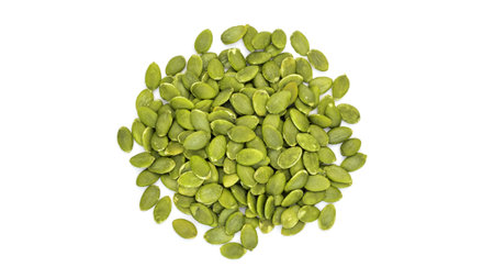Green pumpkin seeds on a white background.の写真素材