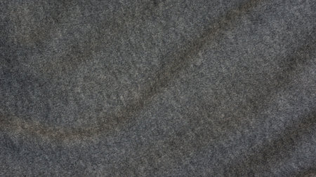 Close up of dark gray soft fabric for a background.の写真素材