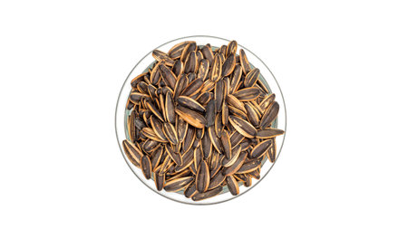 Sunflower seed in a bowl on a white background.の写真素材