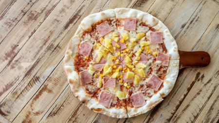 Homemade Italian pizza on a wooden table.の写真素材