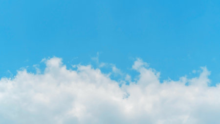 White cloud on a blue sky for a background.の写真素材