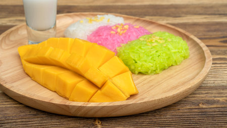 Three colors of sticky rice and ripe mango (Thai dessert).の写真素材