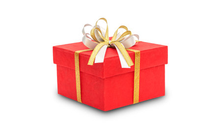 Red gift box and gold ribbon on a white background.の写真素材
