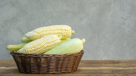 Pure white corn on a wooden table.の写真素材