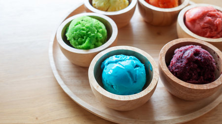Colorful ice cream on a wooden table.