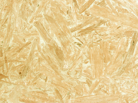 Yellow wood chipboard can be used as a background